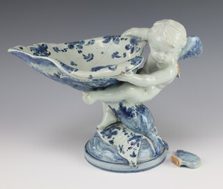 An Italian Cantagalli ceramic centre piece in the form of an angel holding aloft a cornucopia 26cm 