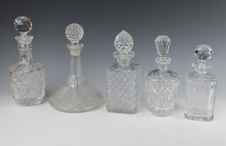 A cut glass octagonal spirit decanter and stopper 21cm, ditto 25cm, another 29cm, a tapered ditto 24cm and a ships decanter 28cm 