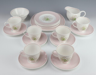 A Susie Cooper Wedgwood part tea set decorated with flowers comprising 6 tea cups, 6 saucers, 6 small plates, sandwich plate, milk jug, sugar bowl 