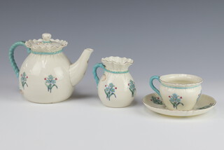 A Goss breakfast teapot, tea cup and saucer and milk jug decorated with spring flowers 