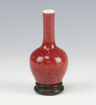 A Chinese Sang de Boeuf baluster vase with elongated neck bearing a 6 character mark to base 10.5cm  