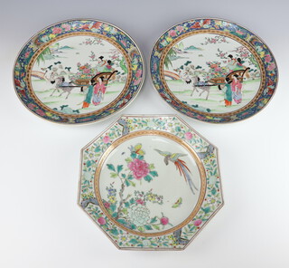 A 20th Century Chinese octagonal plate decorated with birds amongst flowers and insects 28cm together with a pair of 18th Century style plates decorated with figures in landscapes 30cm 
