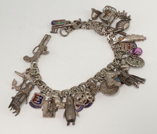 A silver charm bracelet 69 grams 