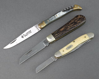 A Laguiole Rossignol folding pocket knife with 8cm blade marked 2476 with corkscrew and horn grip, a 3 bladed folding pocket knife with horn grip and a Wright & Sons of Sheffield folding pocket knife blade marked Real lambsfoot with horn effect grip  