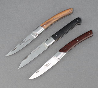 A Le Thiers folding pocket knife with 7cm blade marked Le Theirs Chambriard with wooden grip, a Sauveteng folding pocket knife with 7.5cm blade and ebonised grip, a Le Thiers folding pocket knife with wooden grip 