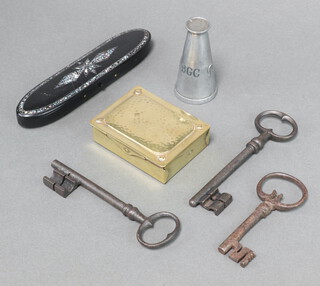 A rectangular Art Nouveau planished brass stamp box, the base marked Ges Gesch 3cm x 8cm x 7cm, 4 antique keys, a Victorian inlaid papier mache spectacle case and an advertising paperweight in the form of a milk churn marked Churn Brand Feeding 8cm x 4cm 