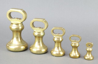 Five various brass bell weights - 7lbs, 4lbs, 2lbs, 1lb and 8 ozs 