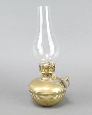 A Hare's brass ships style self righting safety oil lamp with clear glass chimney 13cm 