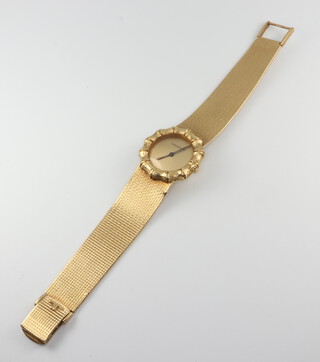 A lady's 18ct yellow gold Jaeger Le Coultre wristwatch contained in a bamboo effect 25mm case numbered 1278758 the movement numbered 2087313 on a ditto textured bracelet, 54 grams including the glass 