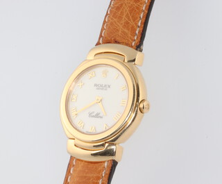 A lady's 18ct yellow gold Rolex Cellini quartz movement wristwatch contained in a 25mm case, having a leather strap with gold clasp, the case numbered 6621265/2360 