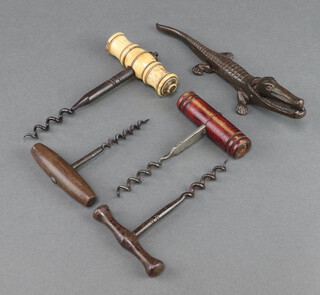 A 19th Century steel corkscrew with bone handle (chipped), 2 18th Century steel corkscrews and a pair of iron nut crackers in the form of a crocodile 19cm 