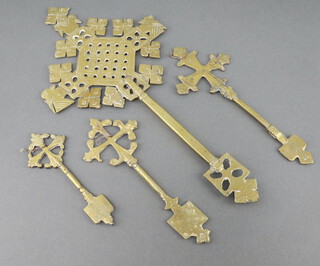 A pierced brass Eastern cross 34cm h x 37cm w together with 3 others 20cm x 7cm, 18cm x 6cm and 13cm x 5cm 