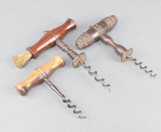 A 19th Century steel and turned mahogany corkscrew complete with brush 6cm and 2 other corkscrews 
