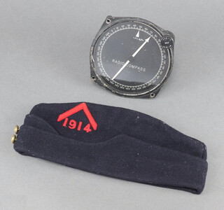 A Canadian blue field service cap dated 1914 together with a Radio compass 