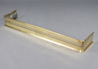 A Victorian pierced brass fender 13cm x 115cm w x 25cm d 