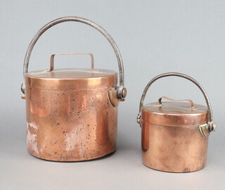 A 19th Century circular copper cooking pot and cover, cylindrical lidded copper cooking pot with polished steel handle 20cm x 23cm and a 1 other 43cm x 15cm 