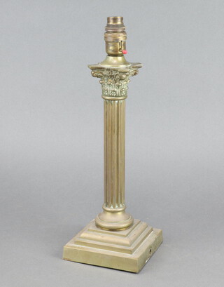 A gilt metal table lamp in the form of a column with stepped base and Corinthian capital 31cm h 