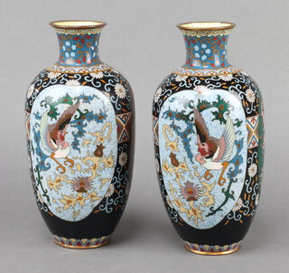 A pair of black ground and floral patterned enamelled club shaped vases 