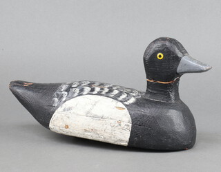A 19th Century black and white painted wooden decoy duck 17cm h x 35cm w x 11cm 