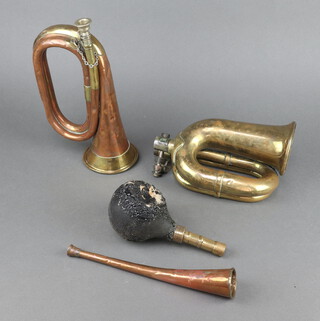 A Premier brass and copper bugle with broad arrow marked Premier British Made 1936 (some dents), a brass taxi horn (rubber bell f) and a small copper hunting horn  