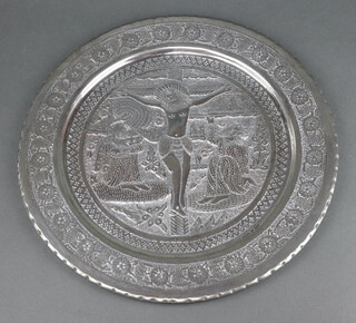 A circular embossed metal tray decorated the crucifixion 40cm 