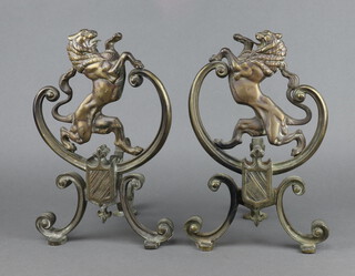 A pair of 19th/20th Century Continental gilt metal fire dogs in the form of rampant lions 35cm x 22cm x 20cm 