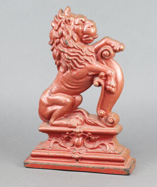 A cast iron doorstop in the form of a rampant lion 34cm x 24cm x 7cm 