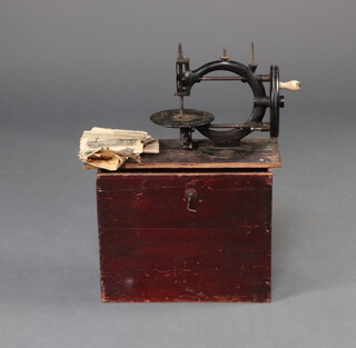 A Little Wanzer Time Utilizer spinning sewing machine complete with instructions, contained in a pine carrying case (lid a/f)