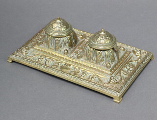 A Victorian cast brass 2 bottle inkwell on panelled supports 7cm x 25cm x 15cm 
