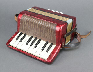 A Hohner Mignon accordion with 8 buttons 