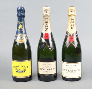 A bottle of Moet and Chandon Imperial champagne, 1 other bottle of Moet and Chandon and bottle of vintage Heidsieck and Co champagne  