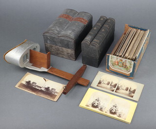 Underwood and Underwood, volumes 1 and 2 "Around The World Through the Stereoscope", approx. 76 cards and "Studies Through the Stereoscope" 32 cards and approx. 65 other cards together with a stereoscopic viewer 