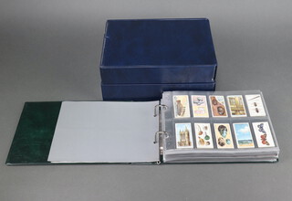 Three albums of cigarette cards including Wills - Coronation Series, The Reign of George V, Our King and Queen, Old Pottery and Porcelain, Do You Know series 1-5, Household Hints series 1 and 2, Life in the Royal Navy, Air Raid Precautions, John Players - Ships Figureheads, Highland Clans, Coronation Series Ceremonial Dress, Churchmans - King's Coronation
