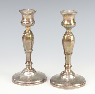 A pair of silver waisted candlesticks Birmingham 1929 18cm 