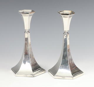 A pair of stylish hexagonal silver candlesticks with splayed bases Sheffield 1929, maker James Deakin & Sons 22cm 