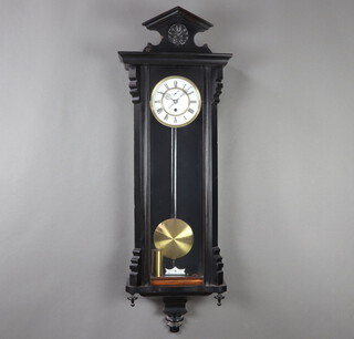 A Vienna style regulator timepiece with 16cm enamelled dial, Roman numerals, minute indicator, complete with pendulum and key, contained in an ebonised case 115cm 