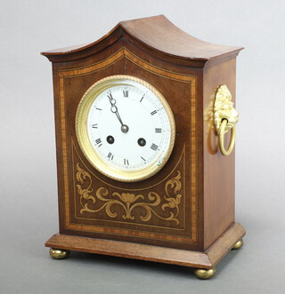 A French 8 day striking mantel clock with 10cm enamelled dial, Roman numerals, contained in a shaped inlaid mahogany case with brass handles to the side 27cm x 20cm x 13cm d 