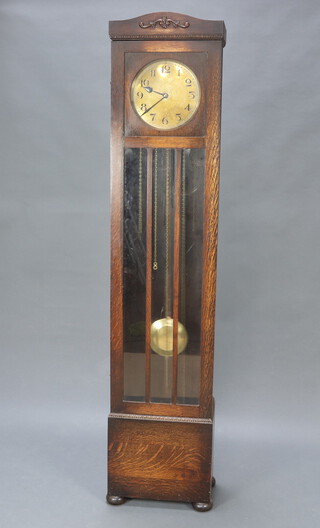 An Edwardian German 8 day striking chiming longcase clock with 26cm brass dial, Arabic numerals contained in an oak case, complete with pendulum and weights 197cm h x 43cm w x 26cm  
