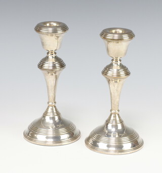 A pair of waisted silver candlesticks Birmingham 1977, 17cm, weighted