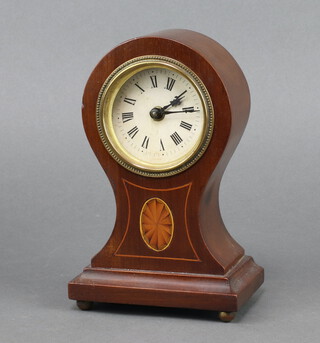An Edwardian timepiece with 8cm paper dial, Roman numerals, contained in an inlaid mahogany balloon shaped case 20cm h x 13cm w x 8cm d  