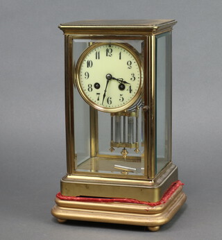 J Marti, a French 8 day striking 4 glass clock with 9cm dial, Roman numerals contained in a gilt metal case 25cm h x 15cm w x 13cm d, complete with pendulum and key 