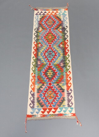 A white, turquoise and blue ground Chobi Kilim runner with 5 diamonds to the centre 200cm x 58cm 