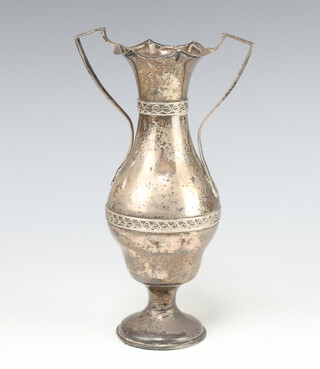 A Victorian silver twin handled baluster vase with strap work decoration, London 1898, 230 grams gross (weighted) 20cm 