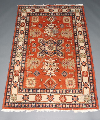 A yellow, orange and blue ground Afghan rug with central medallion within a multi row border 244cm x 166cm 