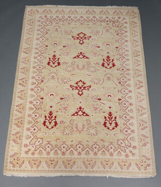 A white and green ground floral patterned Caucasian style rug 205cm x 135cm  