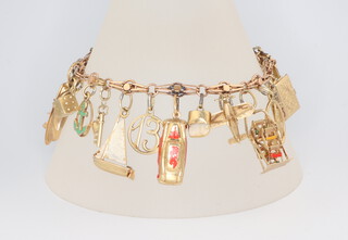 A yellow metal and enamelled charm bracelet 