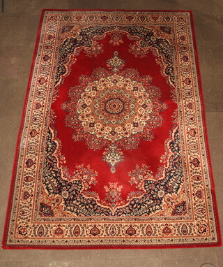 A red, white and blue ground machine made Belgian cotton Persian style rug with central medallion 300cm x 201cm 