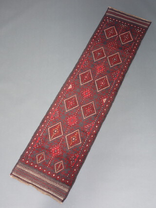 A red and blue ground Meshwani runner with 17 diamonds to the centre 245cm x 58cm 