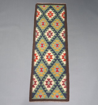 A black, white and orange ground Maimana Kilim runner with all over diamond design 202cm x 65cm 