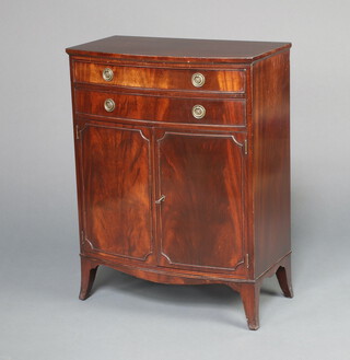 A Georgian style mahogany bow front cabinet fitted 2 drawers above a panelled door, raised on splayed bracket feet 85cm h x 65cm w x 36cm d 